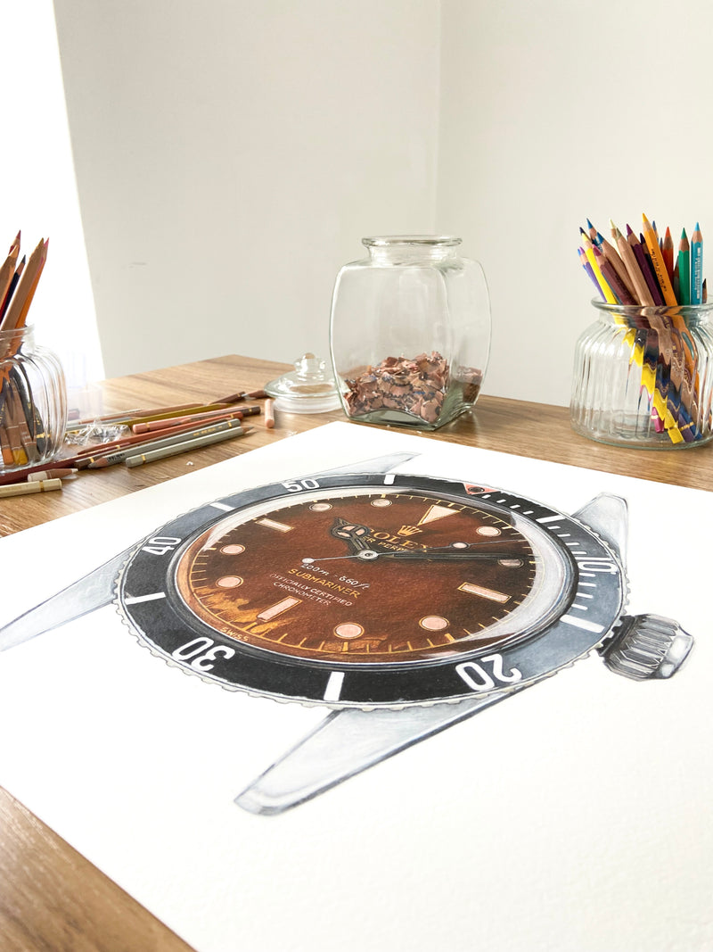 Cecilia Mendoza drawing a Rolex Submariner Ref. 6538 in her studio in Italy with color pencils Caran d'Ache on Arches Paper