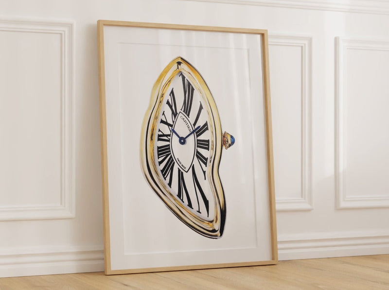 A framed fine art giclée print depicting a stylized, melting clock, reminiscent of the Cartier Crash watch, is displayed on a wall.Cecilia Mendoza CM Visual Artist Ceciliaismyname  Cartier Crash Paris 