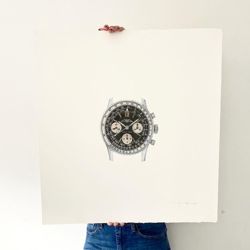 Cecilia Mendoza, also known as CM visual Artist, holding a drawing inspired by Navitimer watch